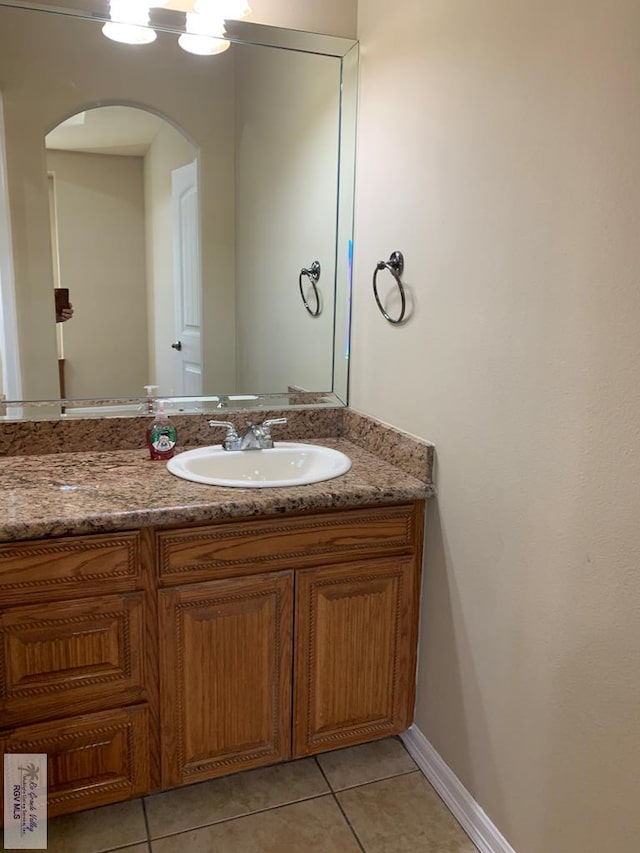 bathroom featuring tile patterned floors and vanity