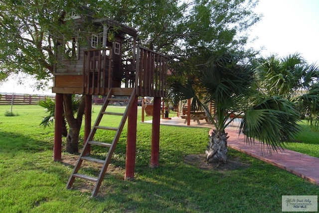 view of play area featuring a lawn