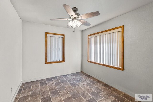 unfurnished room with ceiling fan