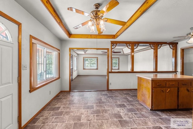 kitchen featuring ceiling fan and plenty of natural light