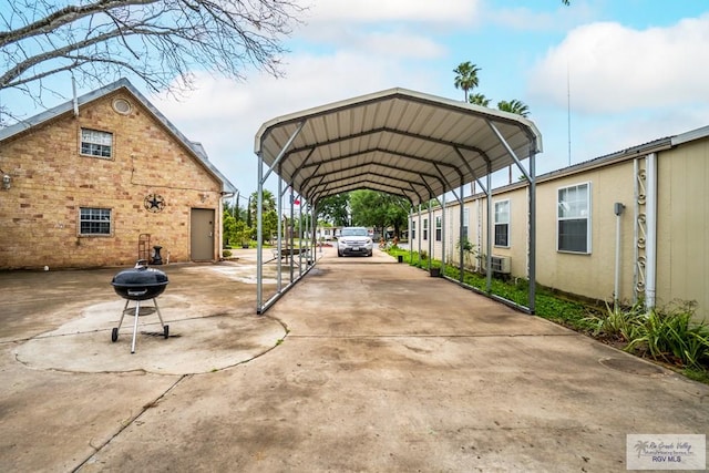 413 Cooper Ln Unit 24, 25, 26, La Feria, TX 78559 - view of vehicle parking featuring a detached carport and driveway