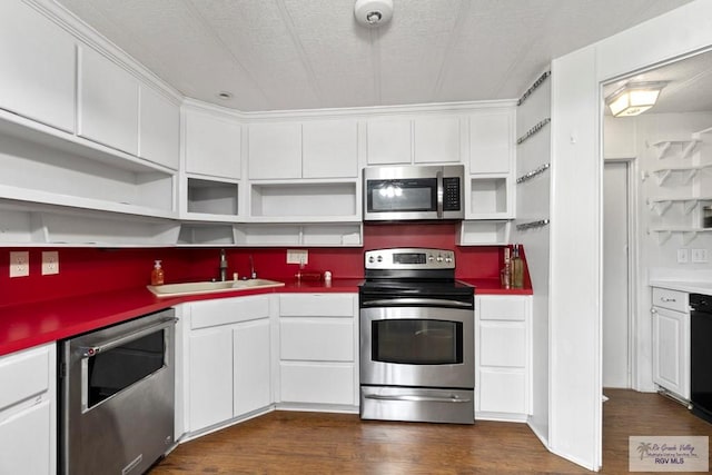 413 Cooper Ln Unit 24, 25, 26, La Feria, TX 78559 - kitchen with appliances with stainless steel finishes, open shelves, a sink, dark wood finished floors, and white cabinets