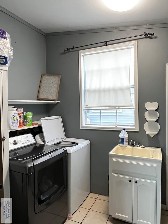413 Cooper Ln Unit 24, 25, 26, La Feria, TX 78559 - laundry area featuring washing machine and dryer, light tile patterned flooring, and a sink