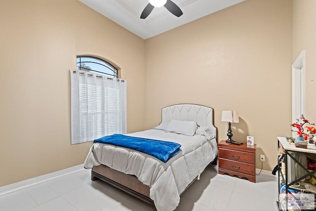 bedroom featuring light tile patterned flooring, ceiling fan, and vaulted ceiling