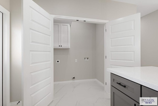 laundry area featuring hookup for an electric dryer, washer hookup, and cabinets