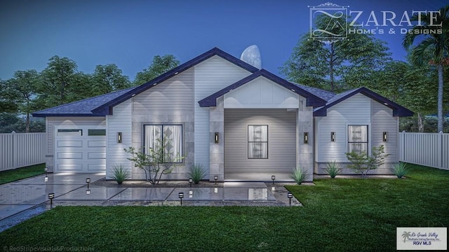 view of front facade featuring a front yard and a garage