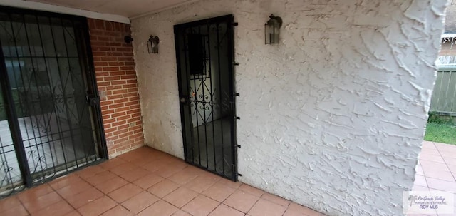4853 Paseo Del Rey Dr, Brownsville, TX 78526 - view of exterior entry featuring brick siding