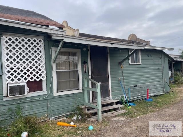 rear view of house with cooling unit