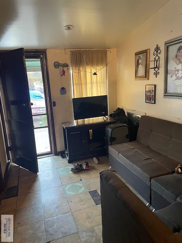 living room featuring vaulted ceiling