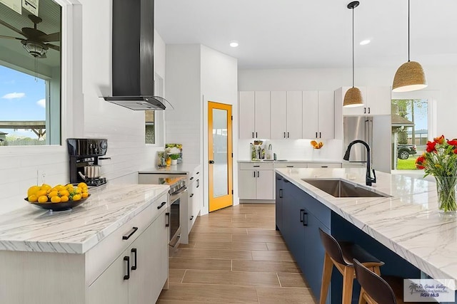 1421 6th St, Harlingen, TX 78550 - kitchen with a sink, ventilation hood, tasteful backsplash, decorative light fixtures, and recessed lighting