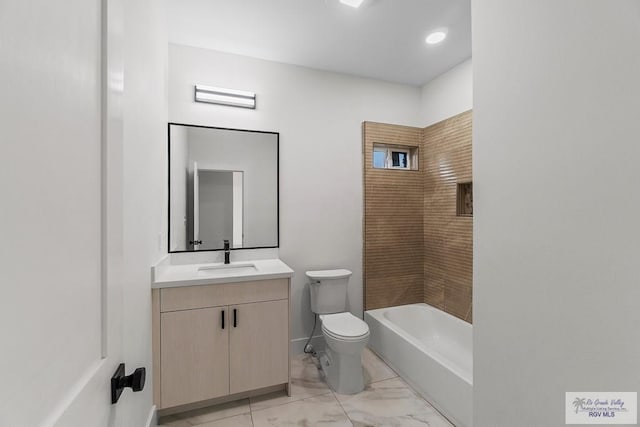 1421 6th St, Harlingen, TX 78550 - full bathroom with vanity, toilet, and marble finish flooring