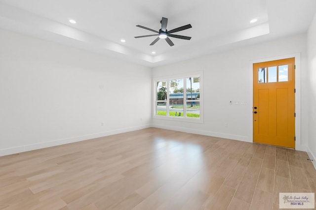 1421 6th St, Harlingen, TX 78550 - entrance foyer featuring a raised ceiling, light wood-type flooring, a ceiling fan, recessed lighting, and baseboards