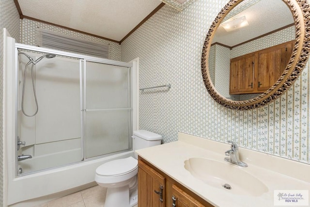 full bathroom with combined bath / shower with glass door, tile patterned floors, vanity, a textured ceiling, and crown molding