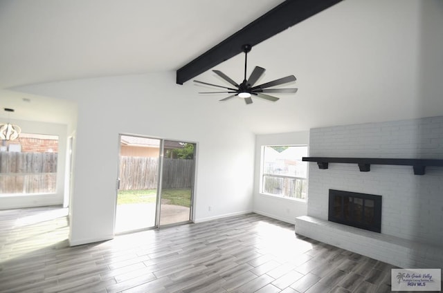 unfurnished living room with a fireplace, hardwood / wood-style floors, plenty of natural light, and ceiling fan