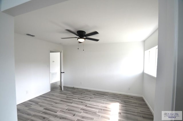 empty room featuring light hardwood / wood-style floors and ceiling fan