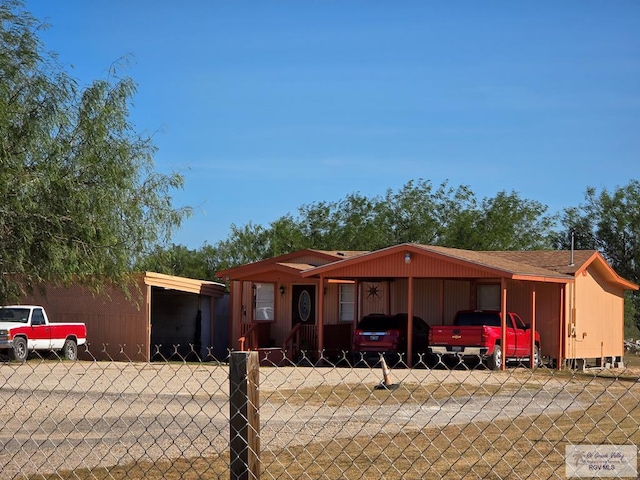 view of front of home with a carport