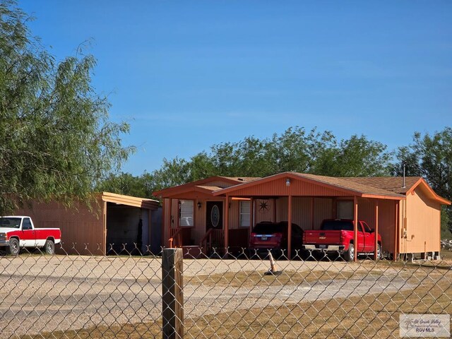 view of front of home with a carport