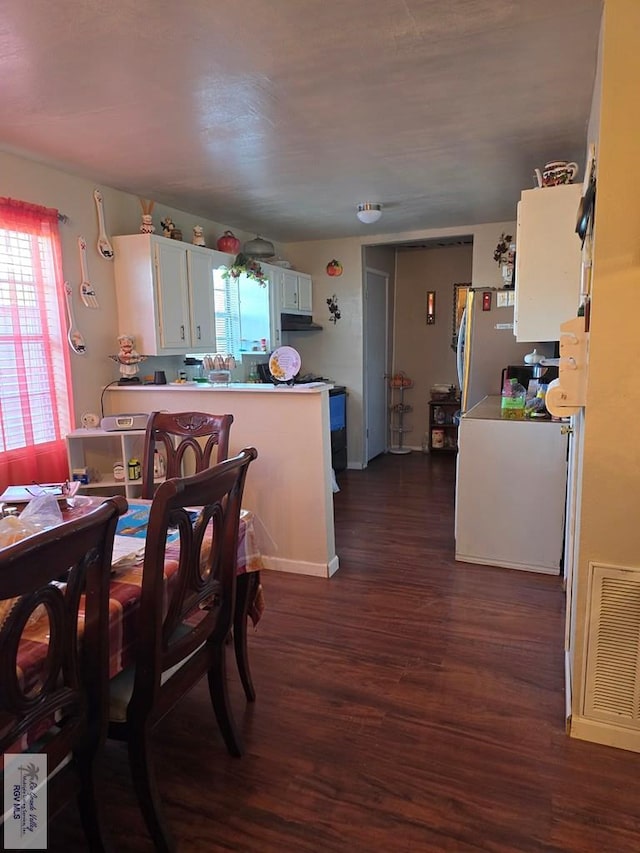 dining room featuring dark hardwood / wood-style floors