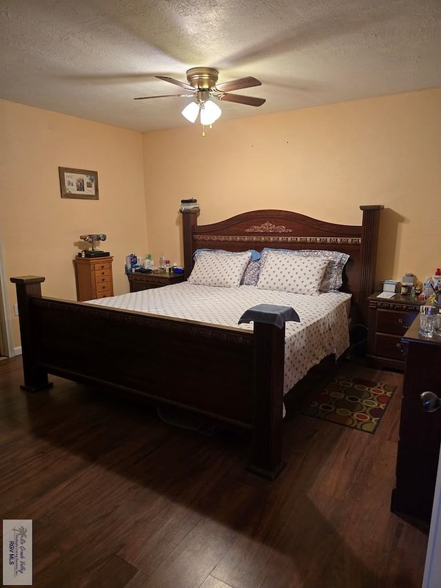 bedroom featuring a textured ceiling, ceiling fan, and dark wood-type flooring
