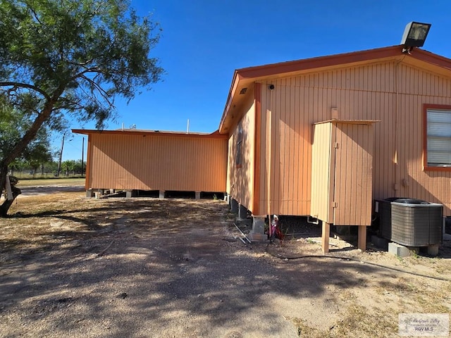 view of side of property with cooling unit