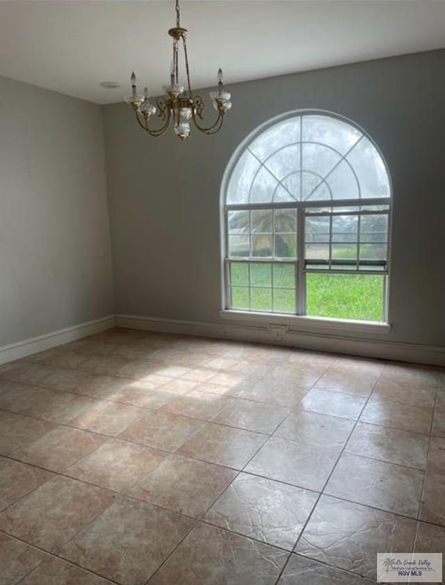 34 Picadilly Cir, Brownsville, TX 78526 - spare room featuring a chandelier and baseboards