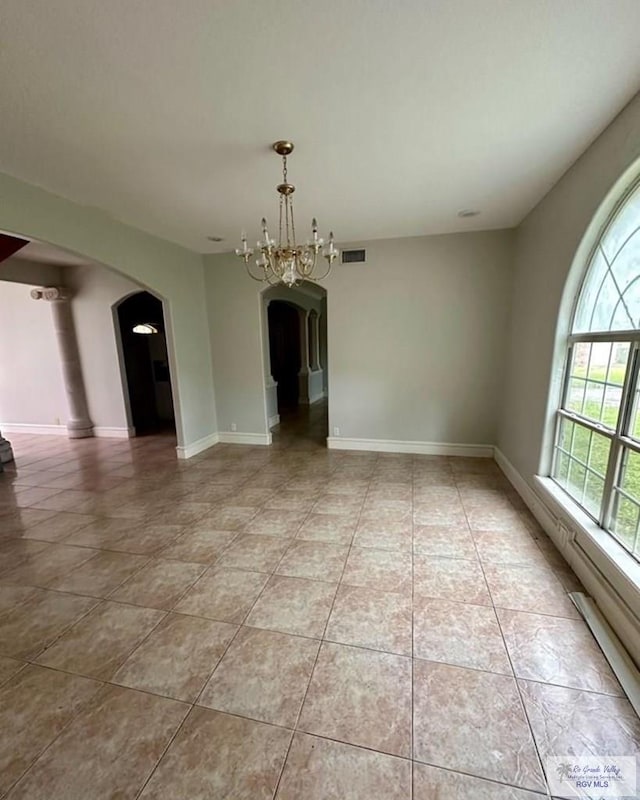 34 Picadilly Cir, Brownsville, TX 78526 - unfurnished dining area with arched walkways, healthy amount of natural light, and light tile patterned flooring