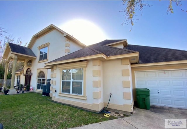 34 Picadilly Cir, Brownsville, TX 78526 - view of front of house featuring roof with shingles, a garage, a front lawn, and stucco siding