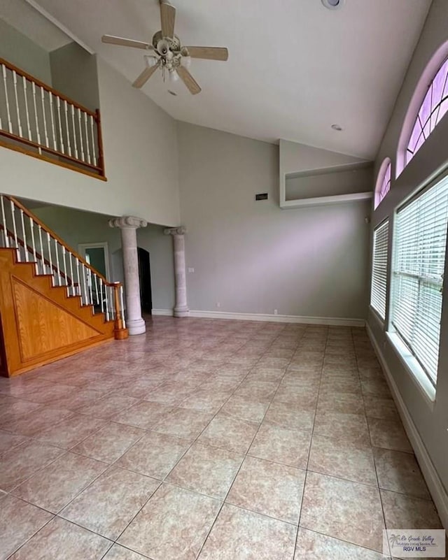 34 Picadilly Cir, Brownsville, TX 78526 - unfurnished living room with healthy amount of natural light, decorative columns, ceiling fan, light tile patterned floors, and high vaulted ceiling