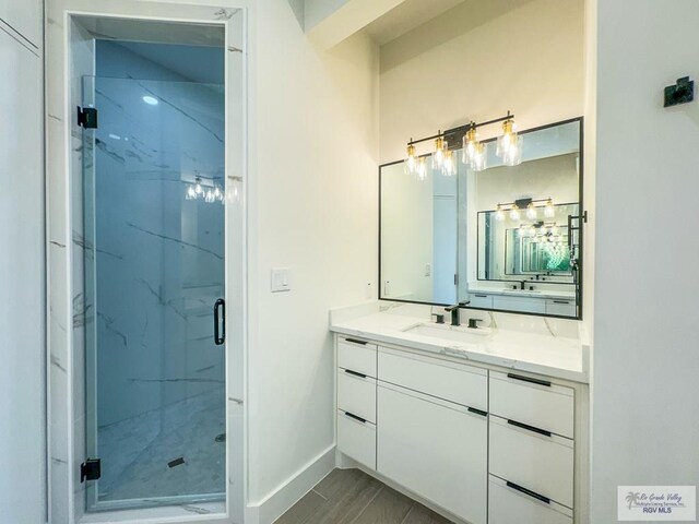 bathroom featuring vanity and walk in shower