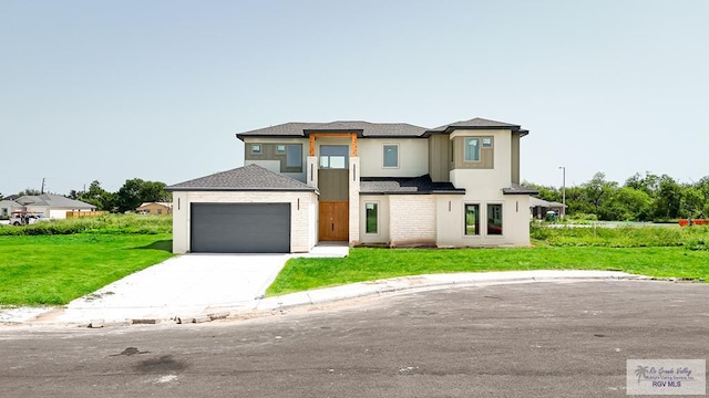 view of front facade featuring a garage and a front yard