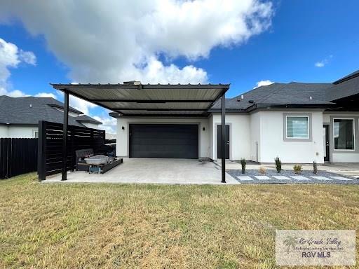 exterior space featuring a lawn and a garage