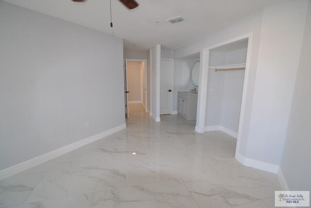 200 Padre Blvd Unit 2307, South Padre Island, TX 78597 - unfurnished bedroom with ceiling fan, ensuite bathroom, and a closet