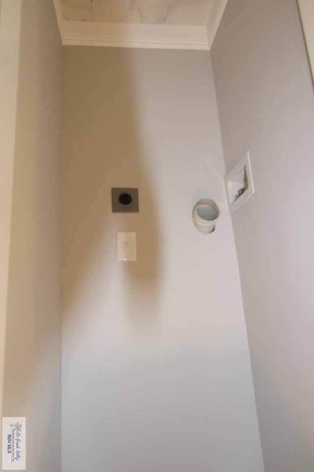 200 Padre Blvd Unit 2307, South Padre Island, TX 78597 - laundry area featuring washer hookup, ornamental molding, and electric dryer hookup