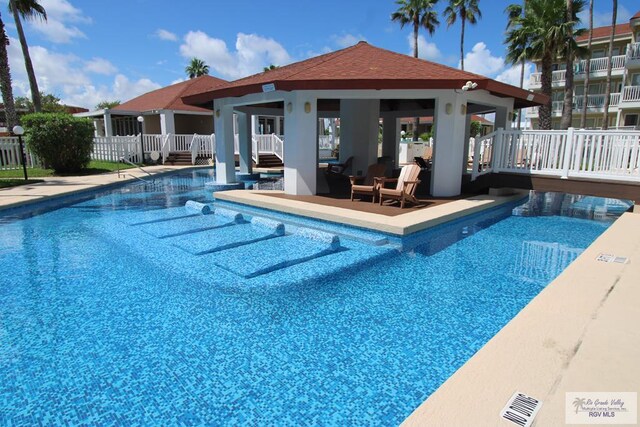 200 Padre Blvd Unit 2307, South Padre Island, TX 78597 - view of swimming pool featuring a patio and a deck