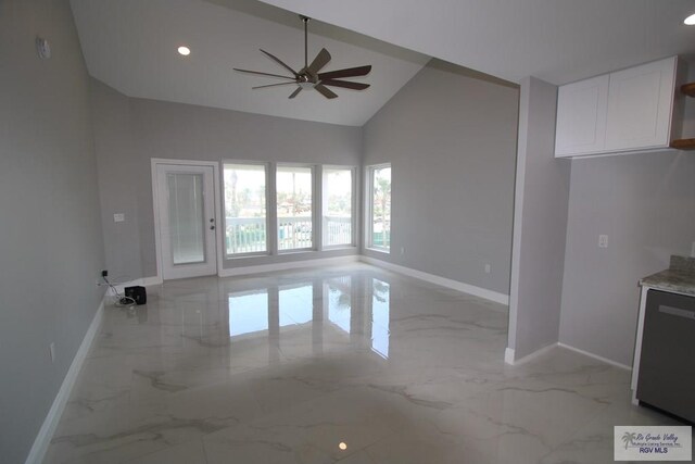 200 Padre Blvd Unit 2307, South Padre Island, TX 78597 - unfurnished living room featuring ceiling fan and high vaulted ceiling