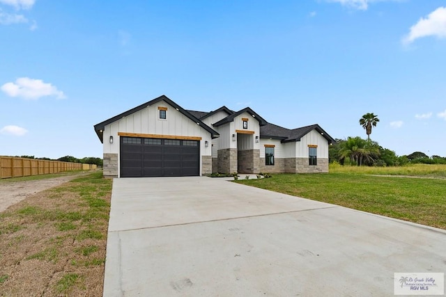 29002 Reynolds Dr # 18, La Feria, TX 78559 - modern farmhouse with board and batten siding, concrete driveway, a garage, and stone siding