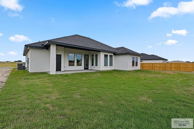 29002 Reynolds Dr # 18, La Feria, TX 78559 - rear view of property with a shingled roof, stucco siding, and a patio area