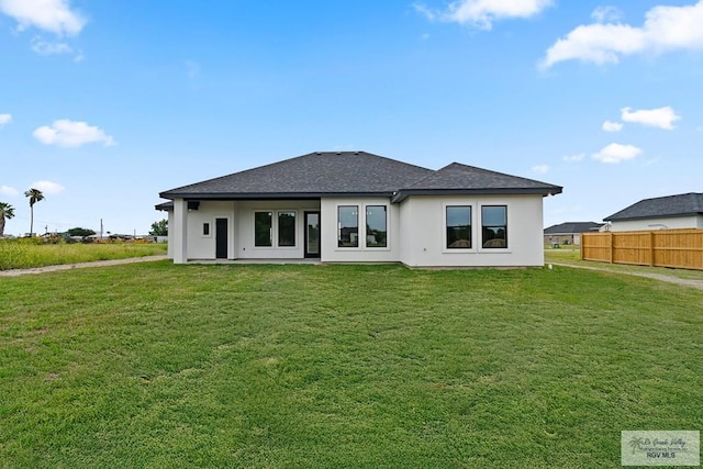 29002 Reynolds Dr # 18, La Feria, TX 78559 - back of property featuring stucco siding and a shingled roof