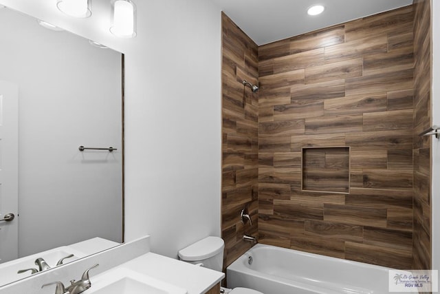 full bathroom with shower / bathing tub combination, vanity, and toilet