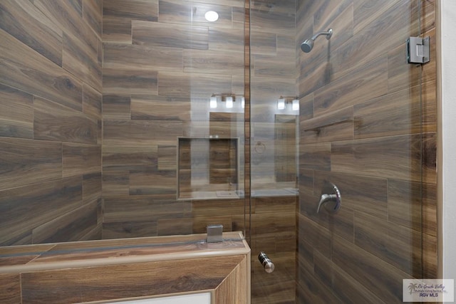 bathroom with a tile shower