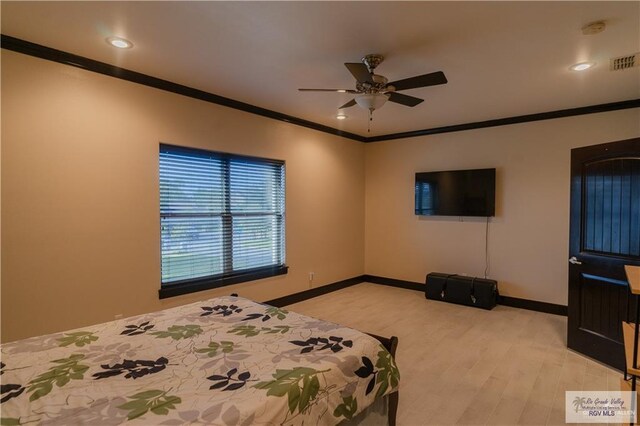 bedroom featuring light wood-type flooring, ceiling fan, and crown molding