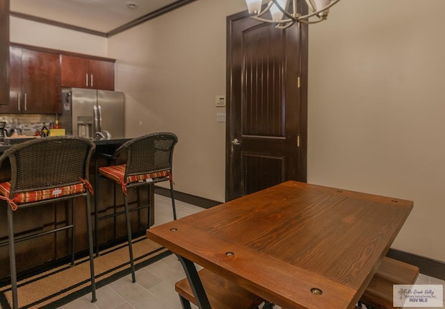 dining space with a notable chandelier