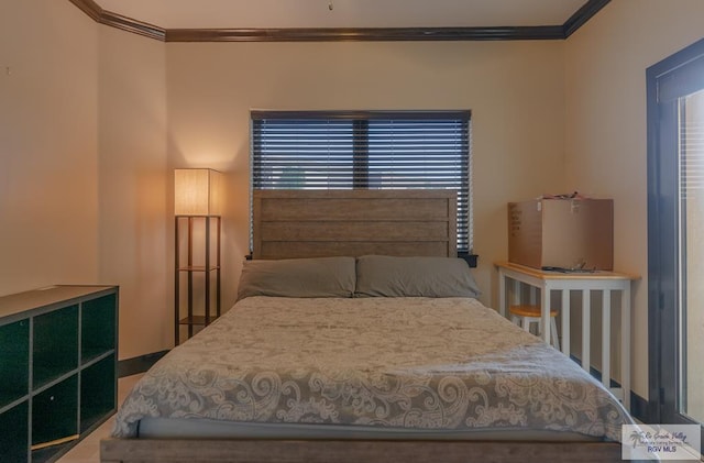 bedroom featuring multiple windows and ornamental molding