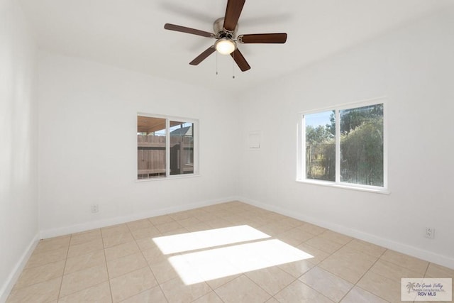 empty room featuring light tile patterned floors and ceiling fan