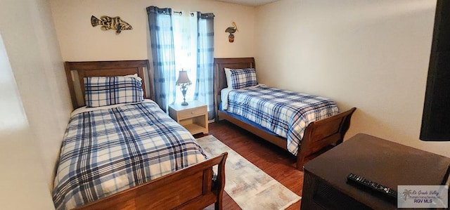 bedroom featuring dark hardwood / wood-style flooring