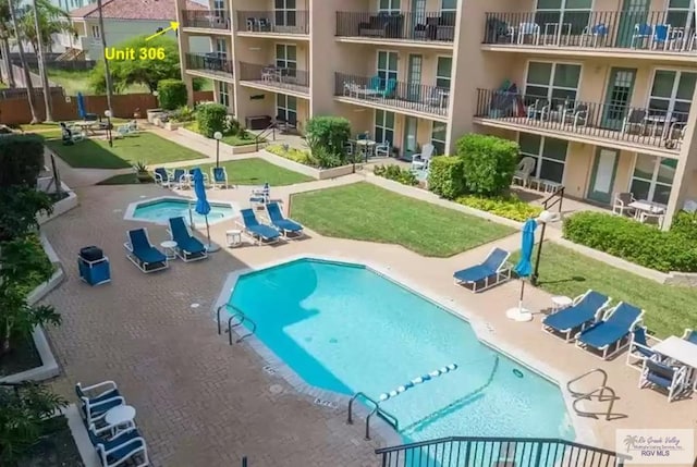 view of swimming pool with a patio area