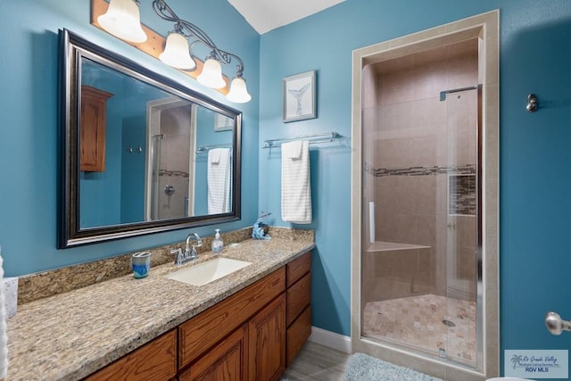 bathroom featuring vanity and walk in shower