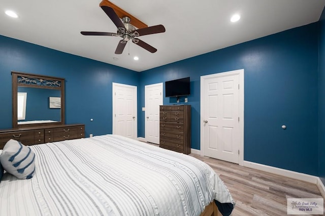 bedroom with light wood-type flooring and ceiling fan