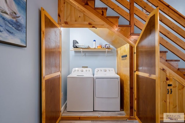 laundry room featuring washing machine and clothes dryer