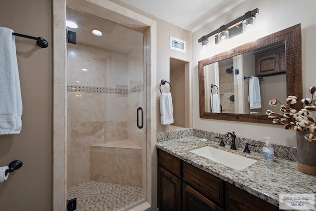 bathroom with vanity and walk in shower